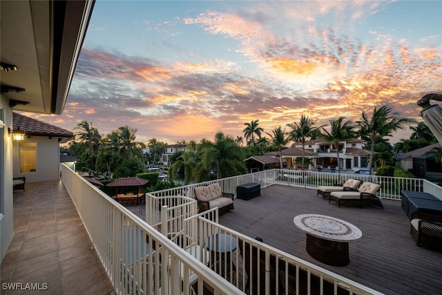 balcony at dusk featuring outdoor lounge area