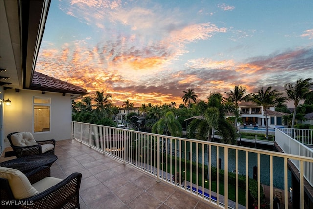 view of balcony at dusk