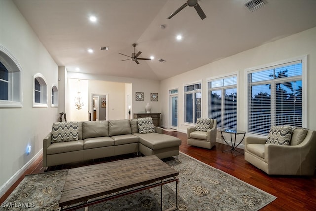 living room featuring ceiling fan, dark hardwood / wood-style floors, and vaulted ceiling