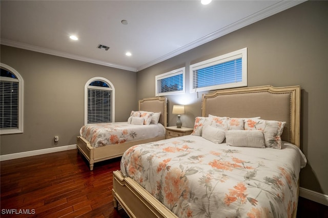 bedroom featuring crown molding and dark hardwood / wood-style floors