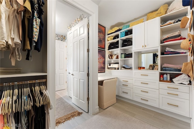 walk in closet featuring light wood-type flooring