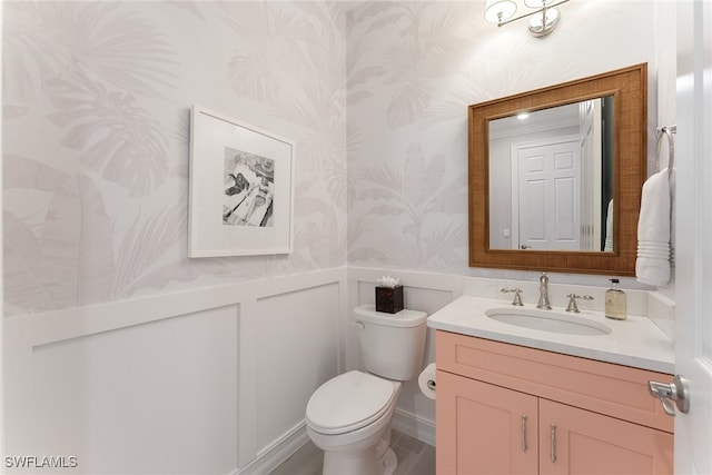 bathroom with vanity and toilet