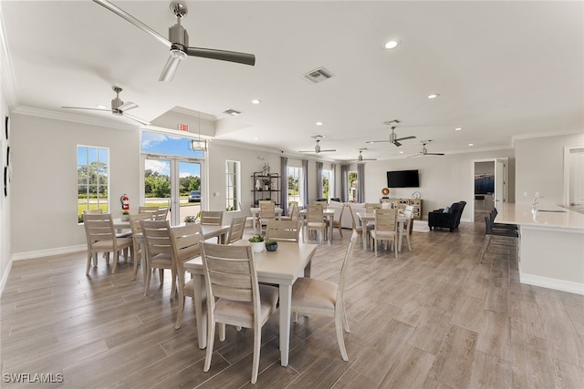 dining area featuring crown molding and french doors