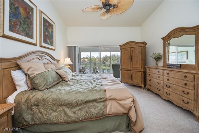 bedroom featuring light carpet, access to outside, and vaulted ceiling