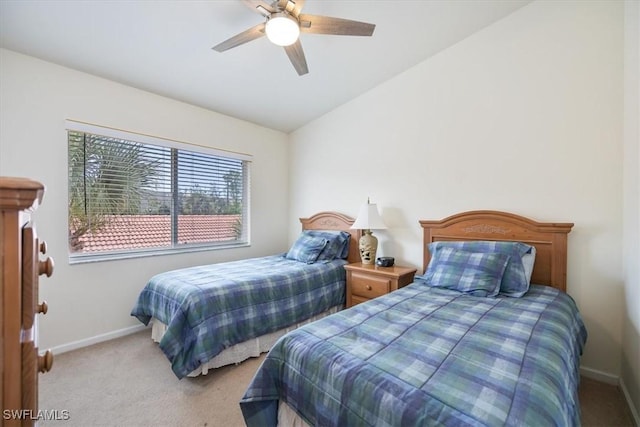 bedroom with lofted ceiling, light carpet, and ceiling fan