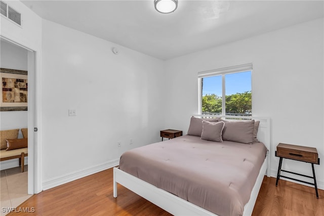 bedroom featuring hardwood / wood-style floors