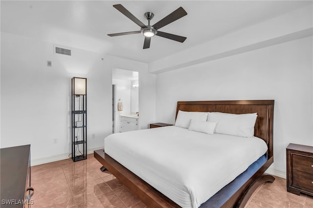 bedroom with ensuite bath and ceiling fan