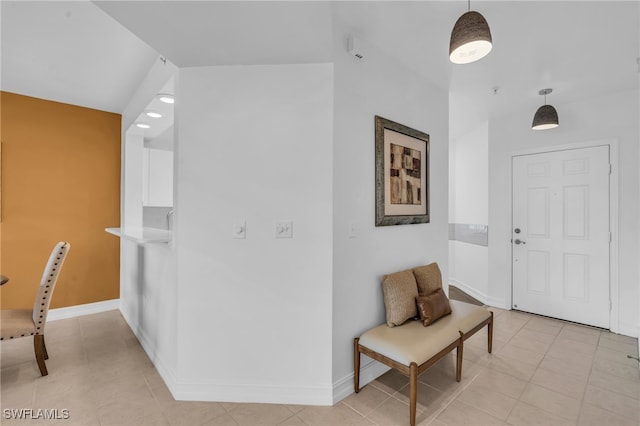 foyer featuring light tile patterned flooring