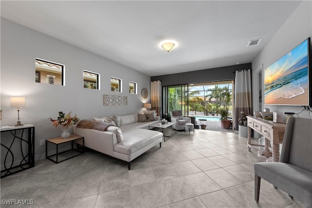 living room with light tile patterned floors