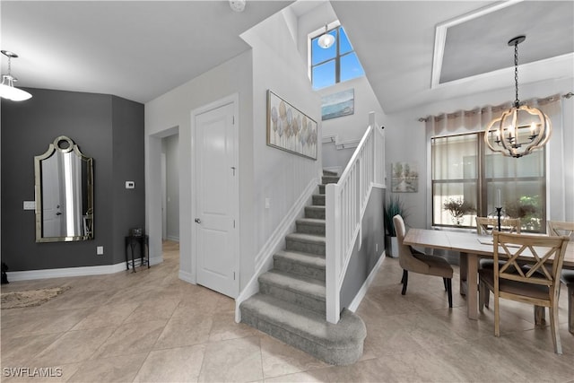 staircase with tile patterned flooring and a chandelier