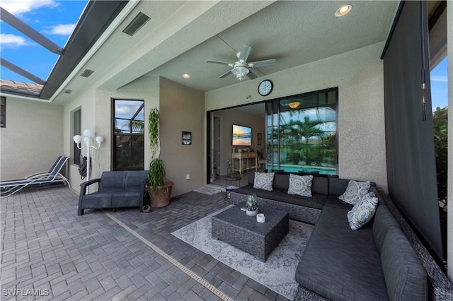 view of patio with outdoor lounge area and ceiling fan