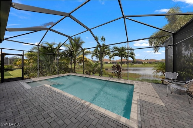 view of pool with a lanai, a patio area, and a water view