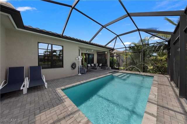 view of pool featuring a patio area and a lanai