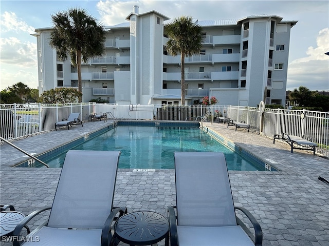 view of swimming pool with a patio area