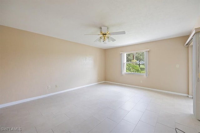 spare room with ceiling fan