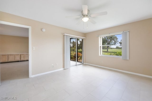 tiled empty room with ceiling fan