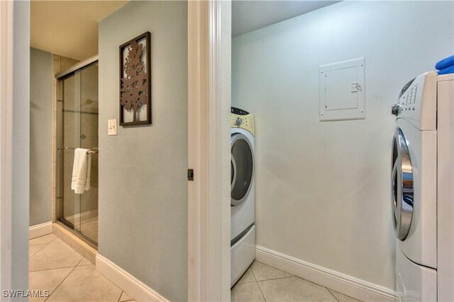 laundry area featuring light tile patterned floors and electric panel