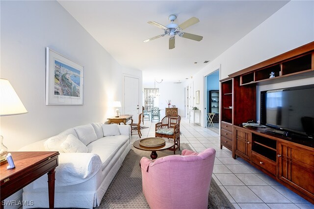 tiled living room featuring ceiling fan