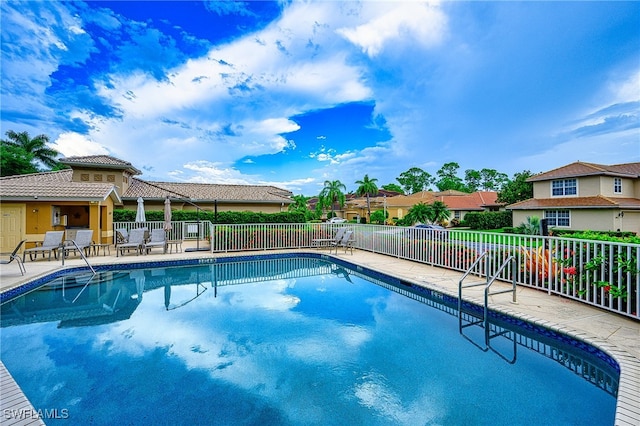 view of swimming pool with a patio