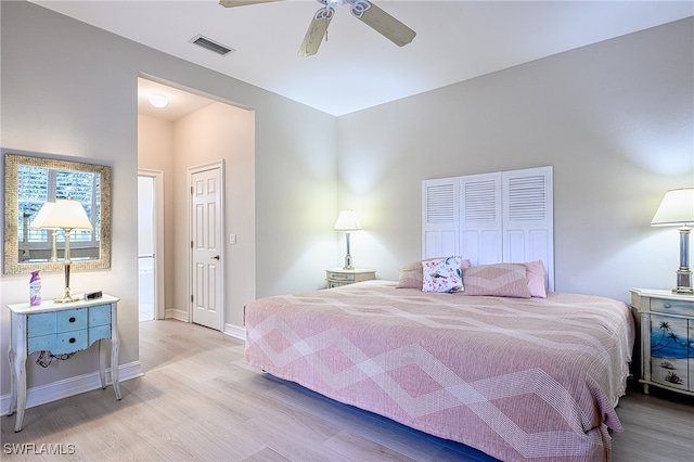 bedroom with ceiling fan and light hardwood / wood-style flooring