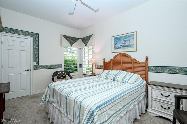 bedroom featuring ceiling fan and light colored carpet