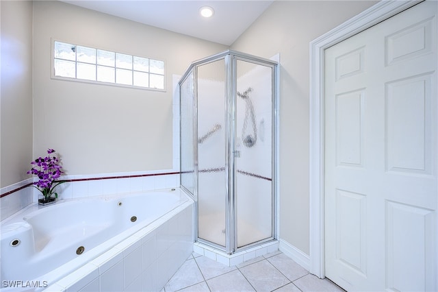 bathroom featuring tile patterned flooring and independent shower and bath