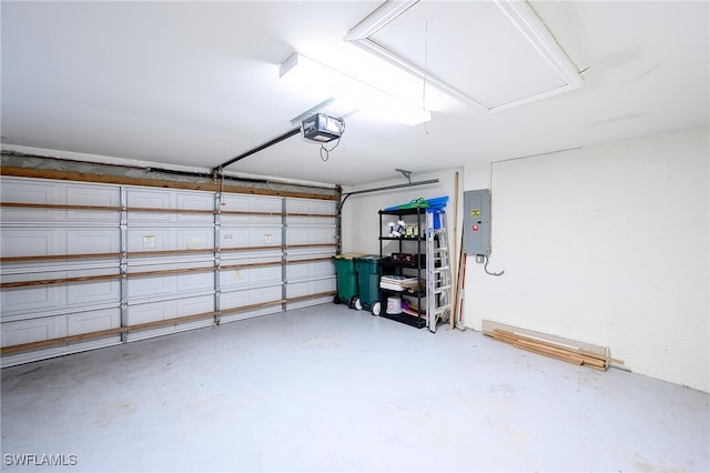 garage featuring a garage door opener and electric panel