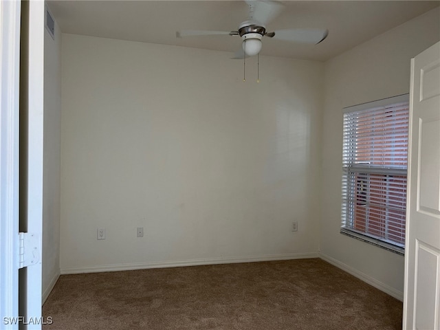 unfurnished room with carpet and ceiling fan