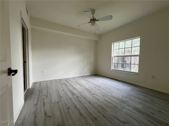 unfurnished room featuring ceiling fan and light hardwood / wood-style flooring