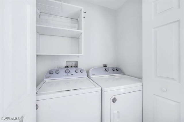 washroom featuring washer and dryer