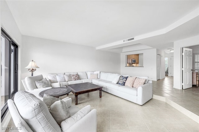 living room with light tile patterned flooring