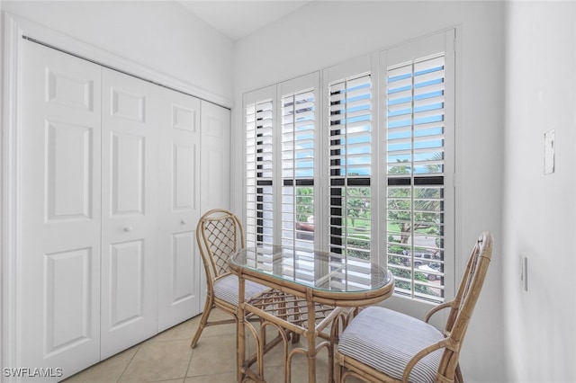 dining area featuring light tile patterned flooring