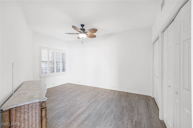 unfurnished bedroom with hardwood / wood-style flooring and ceiling fan