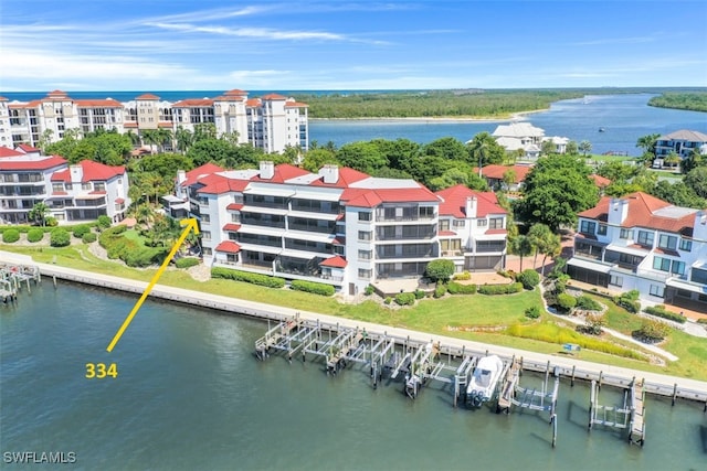 birds eye view of property with a water view