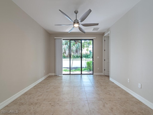 empty room featuring visible vents, a ceiling fan, baseboards, and light tile patterned floors