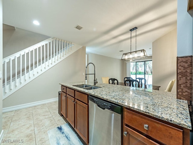 kitchen featuring a sink, brown cabinetry, dishwasher, light stone countertops, and visible vents