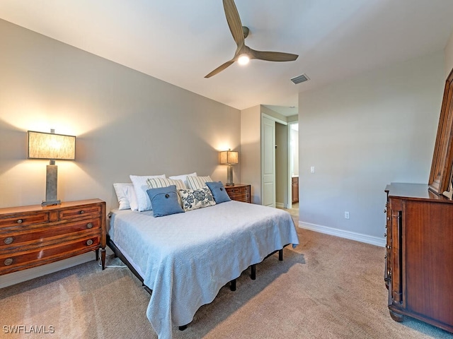 bedroom featuring visible vents, a ceiling fan, baseboards, and light carpet