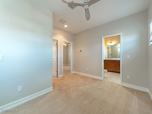 7777 Bristol Cir, Naples, FL 34120 - unfurnished bedroom with light carpet, ensuite bathroom, and recessed lighting
