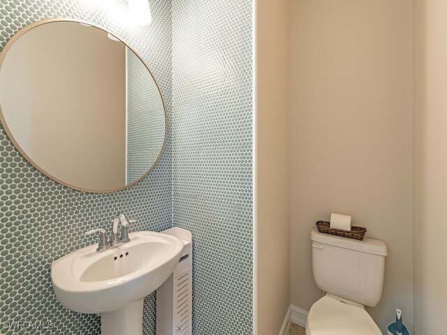 bathroom with sink and toilet