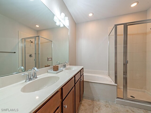 bathroom with vanity, independent shower and bath, and tile patterned floors