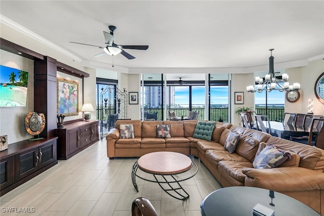 living room with crown molding and ceiling fan with notable chandelier