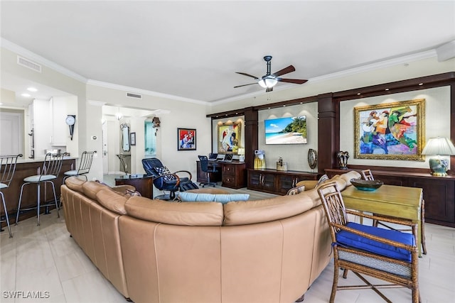 living room featuring crown molding and ceiling fan