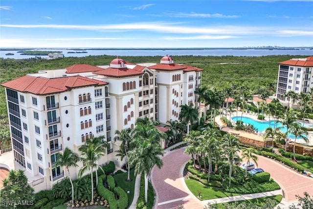 birds eye view of property with a water view