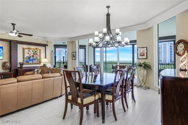 dining space with crown molding and ceiling fan with notable chandelier