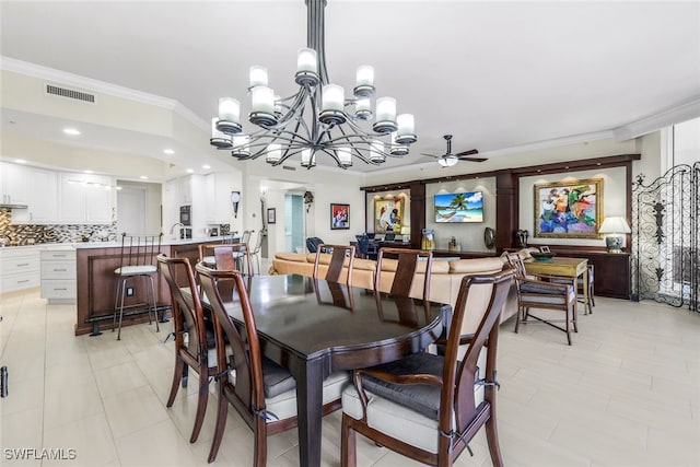 dining room featuring crown molding and ceiling fan