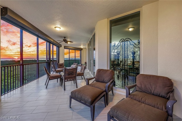 sunroom with ceiling fan