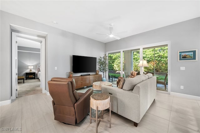 tiled living room featuring ceiling fan