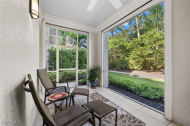 sunroom with ceiling fan