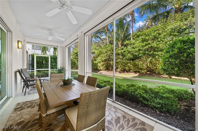 sunroom featuring ceiling fan