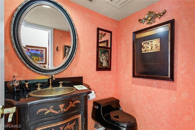 bathroom featuring vanity and visible vents